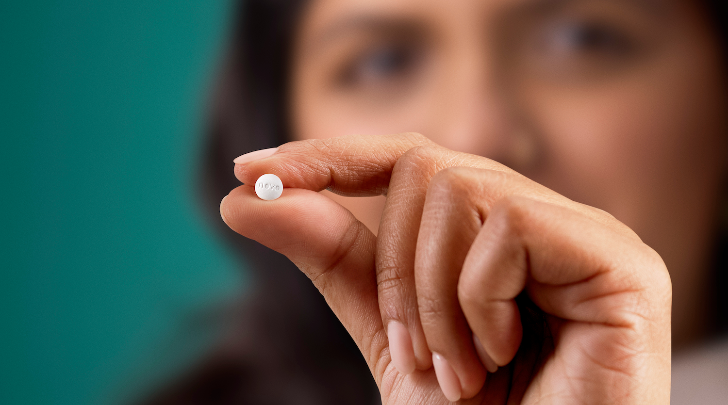 Photo of person holding a pill