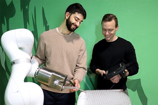 Two men testing equipment