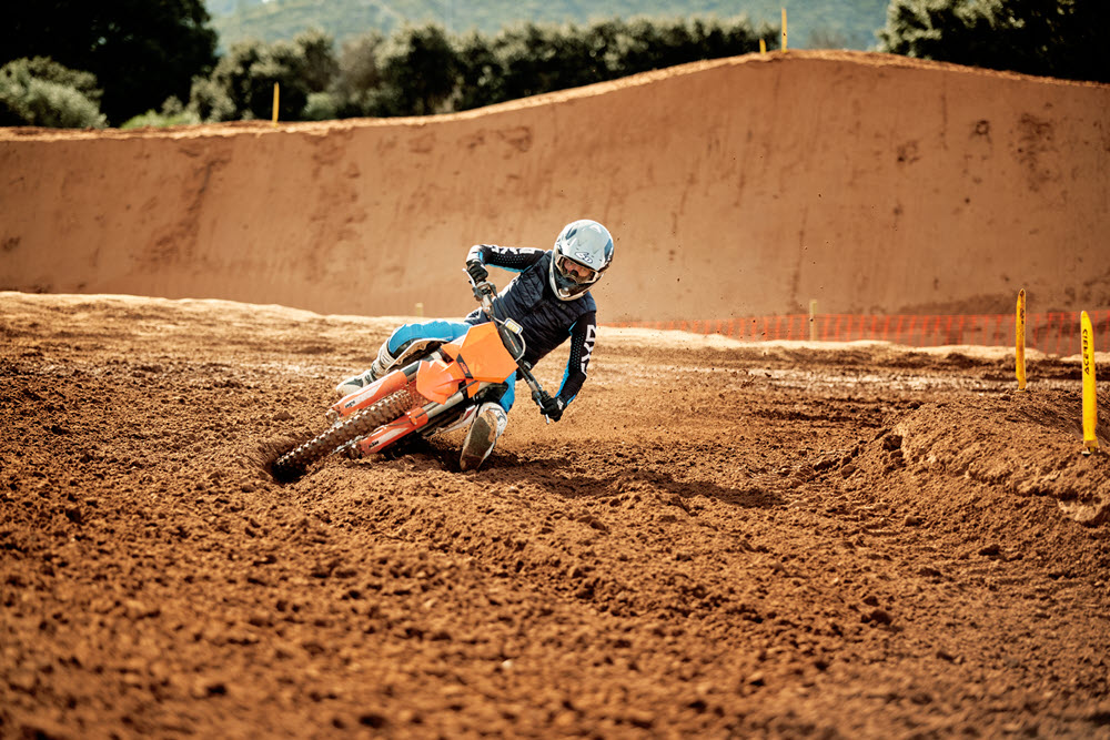 William taking the corner almost lying down on his bike