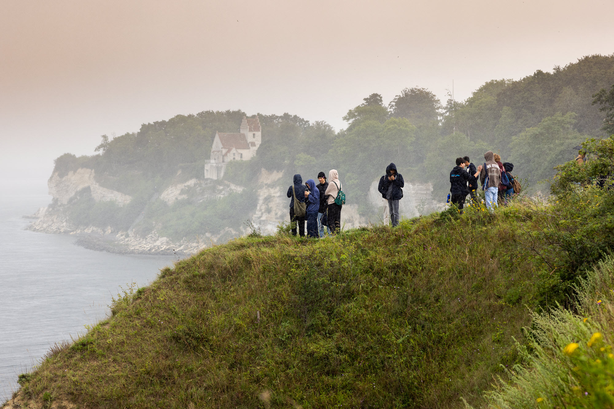 Image of young people hiking Danmark coastline