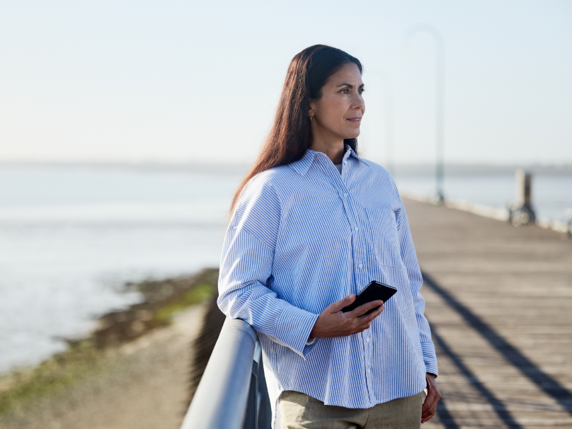 Woman holding her mobile - not real patient