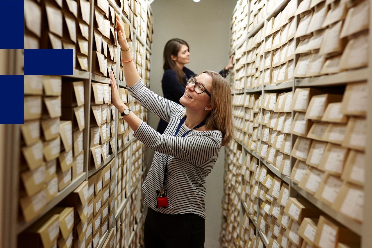 Photo of two people looking at items on a shelf