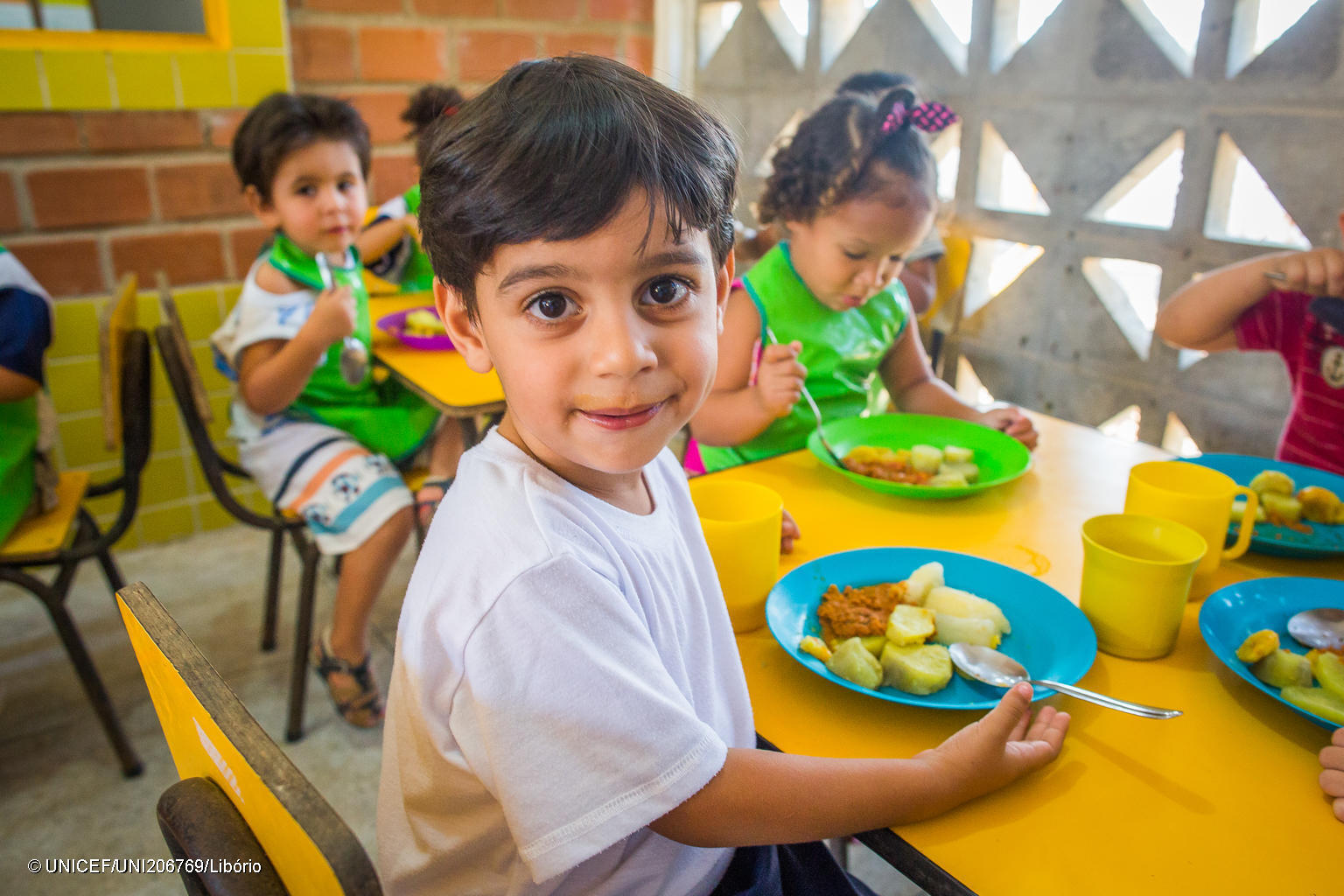 Photo of young persons eating lunch