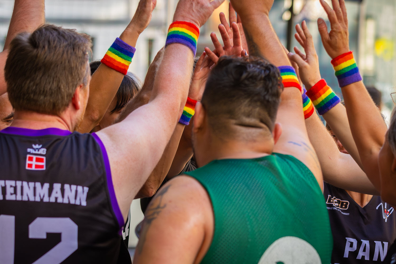 Group of people high-fiving playing basketball