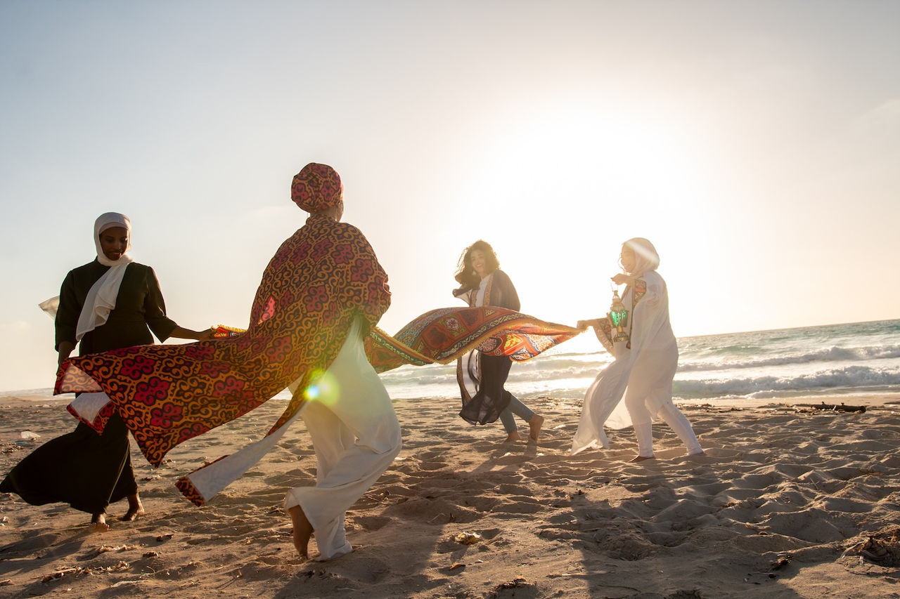 Women dancing on the beach
