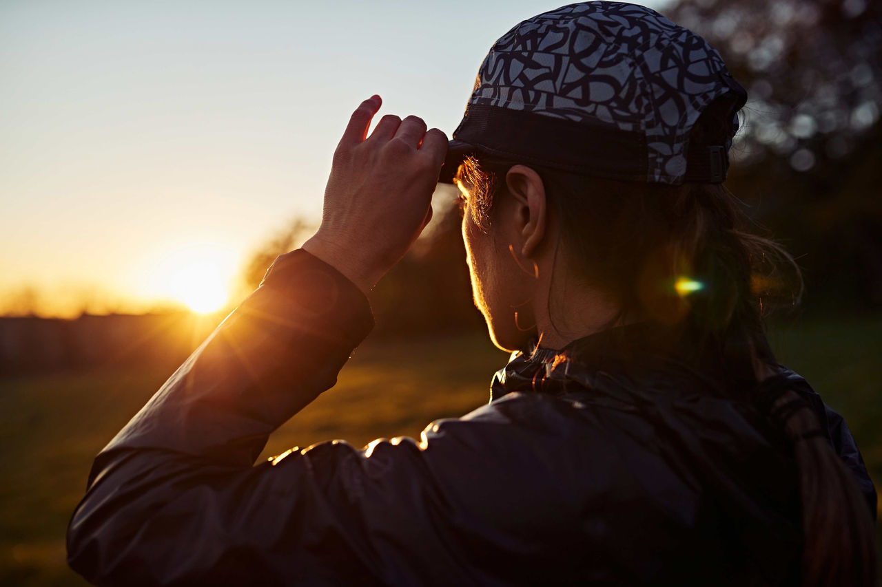 Person looking at a sunrise